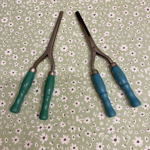 Antique Curling Irons from the 1930's with blue and green handles.