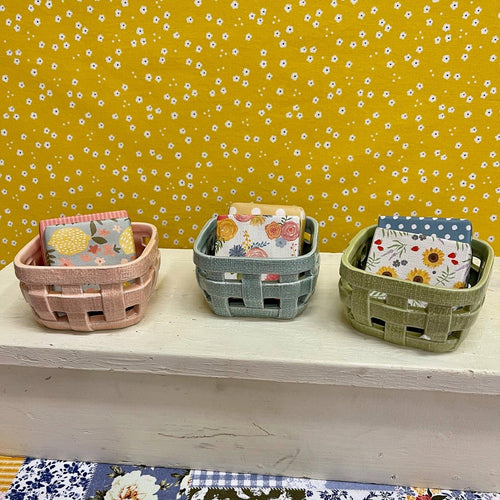 Little Basket Soap Dishes with floral paper wrapped soaps.