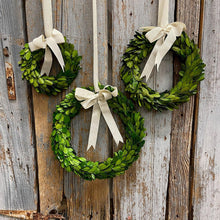 Load image into Gallery viewer, Beautiful green Boxwood Wreaths with creamy white ribbons.