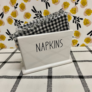 Ceramic Bright White Napkin Holder with black NAPKIN lettering.