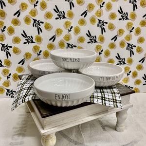 Ceramic white bowls each with wording in black