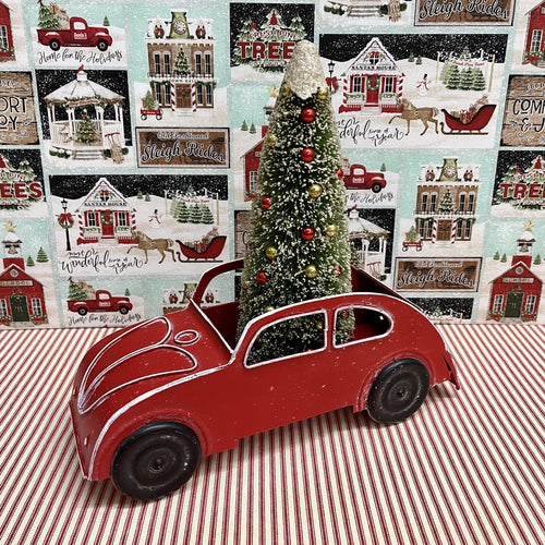 Bright red metal car with open top