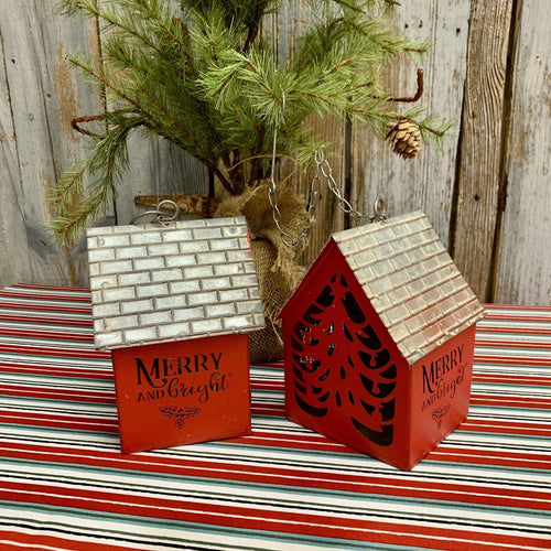 Red metal hanging house ornament with cut out lettering and tree