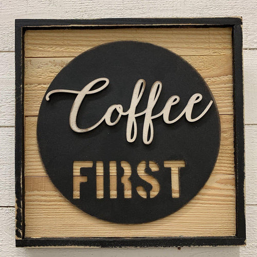 Wood coffee sign that says coffee first
