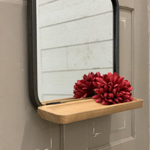 Decorative wall mirror with fold down shelf