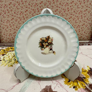 Vintage Style Decorative Plate with floral design in pastel colors.