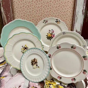 Vintage Style Decorative Plates with floral designs in pastel colors.