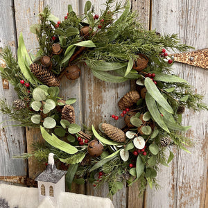 Eucalyptus and jingle bell wreath with tiny pinecones and little rusty bells