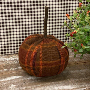 Handmade pumpkin in plain fabric with wood stem