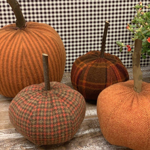 Solf handmade fabric pumpkins in fall colors and wood stem
