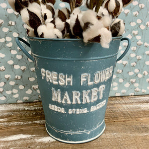 Blue metal bucket with white lettering Fresh Flower Market