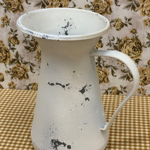 Decorative distressed white pitcher