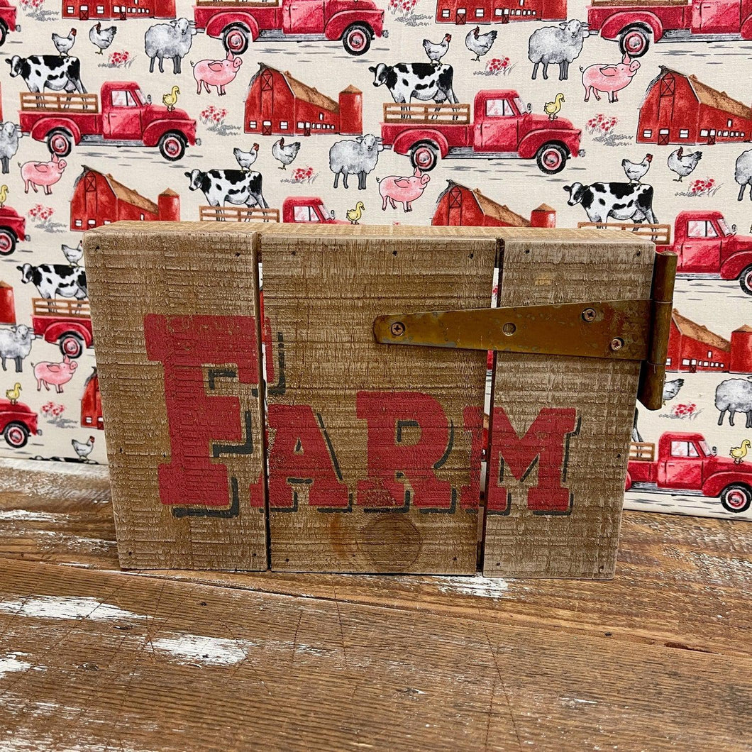 Farmhouse Sign made from reclaimed wood with rusty hinge.