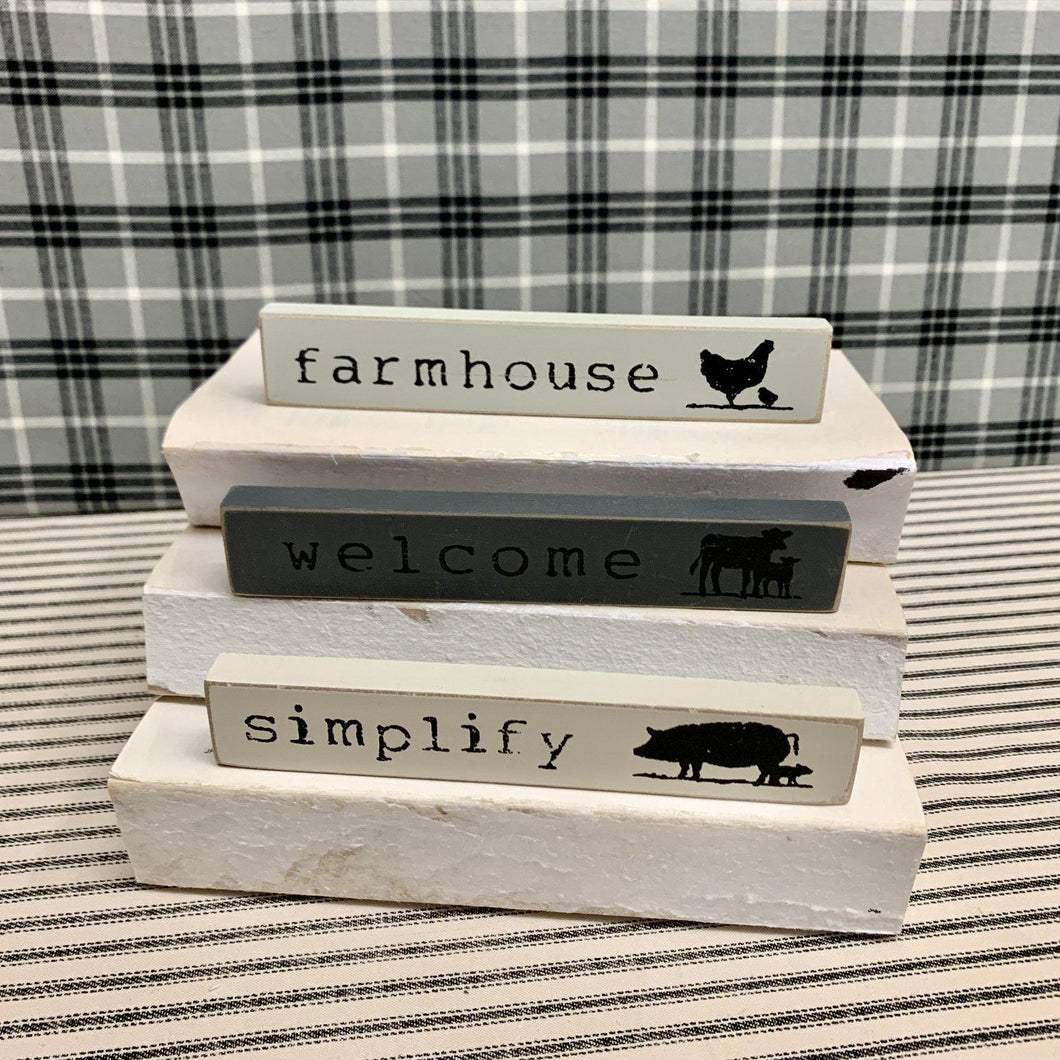 Three farmhouse signs with farm animals and country sayings