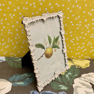 A lovely floral picture frame with slightly distressed metal edging