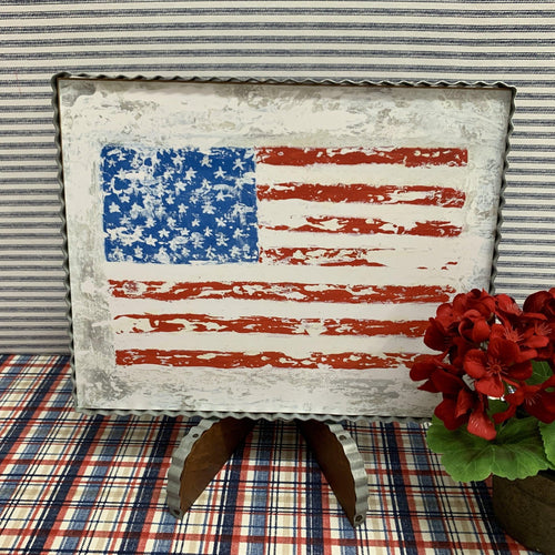 Framed art in corrugated metal with the flag in bright reds and blues