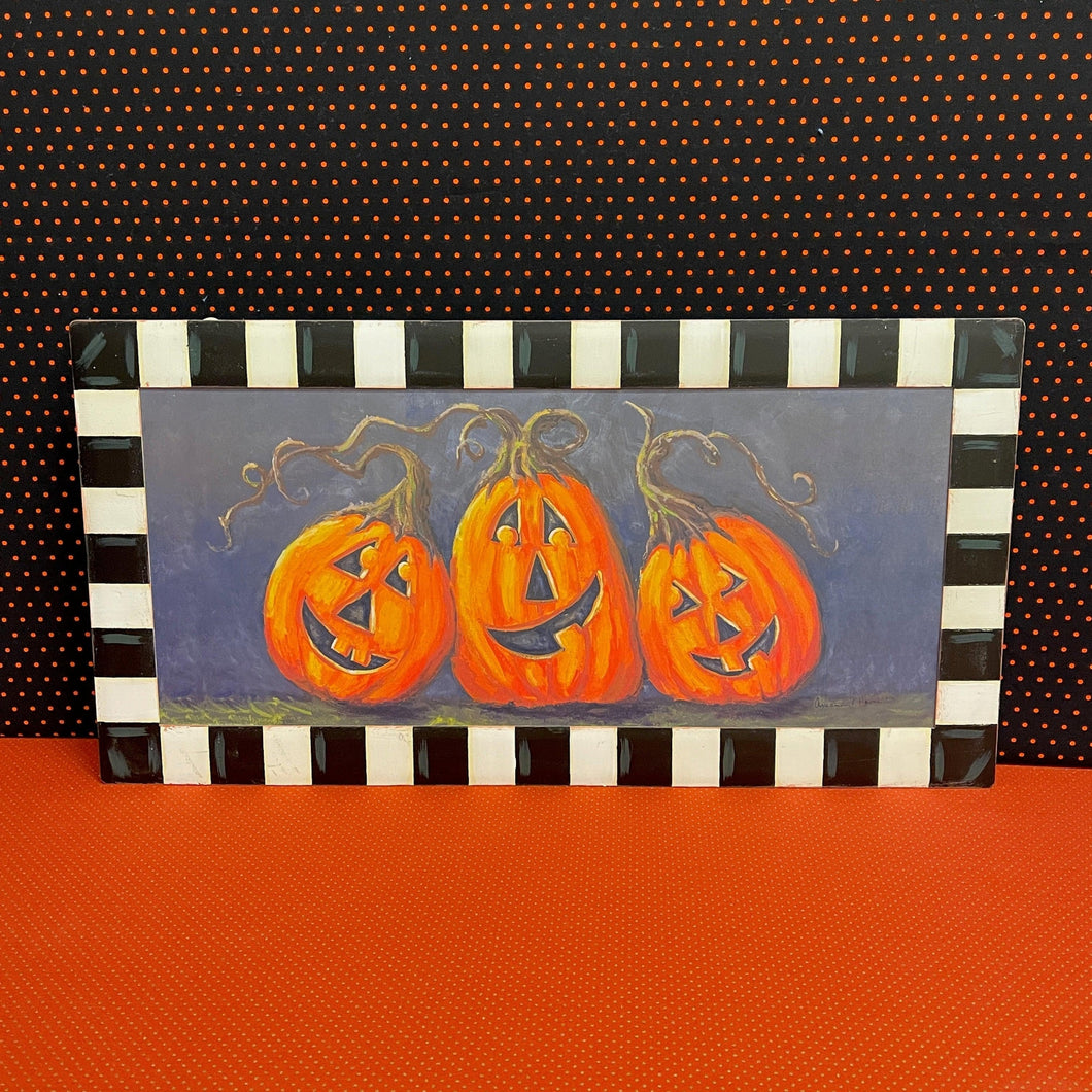 Halloween Canvas Painting framed in black and white metal.