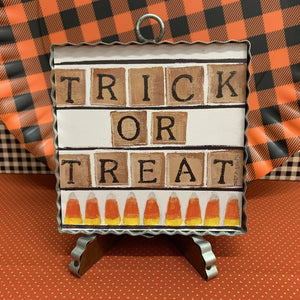 Trick or Treat sign on canvas framed in corrugated metal
