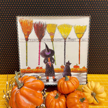 Load image into Gallery viewer, Halloween Framed Art Print with little witch, black cat and magical brooms.