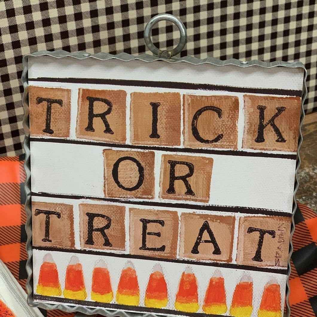 Trick or Treat sign on canvas framed in corrugated metal