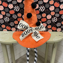 Load image into Gallery viewer, Orange Halloween hat with black pom poms, BOO bows and dangle legs