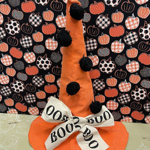 Orange Halloween hat with black pom poms and BOO bow