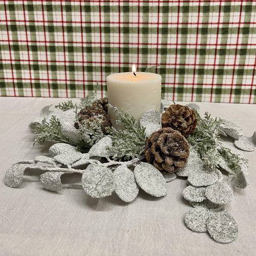 Lovely holiday Candle Ring eucalyptus and pine cones sprinkled with snow.