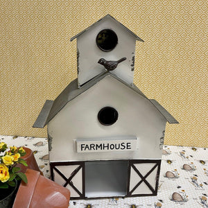 Large white Metal Barn Birdhouse with charming details including a little bird perched on the roof.
