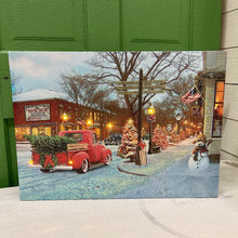 Load image into Gallery viewer, Lighted canvas Christmas sign with vintage town scene