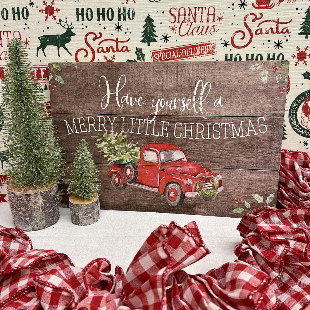 Merry Christmas wood sign with bright red farm truck, tree and wreath