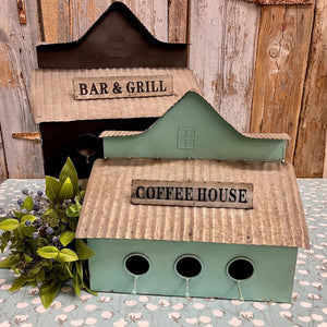 Metal Birdhouses in black and aqua with Bar & Grill and Coffee House signs.