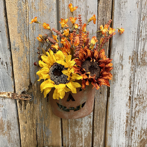 Painted tin bucket with jack o' Lantern face with Fall florals