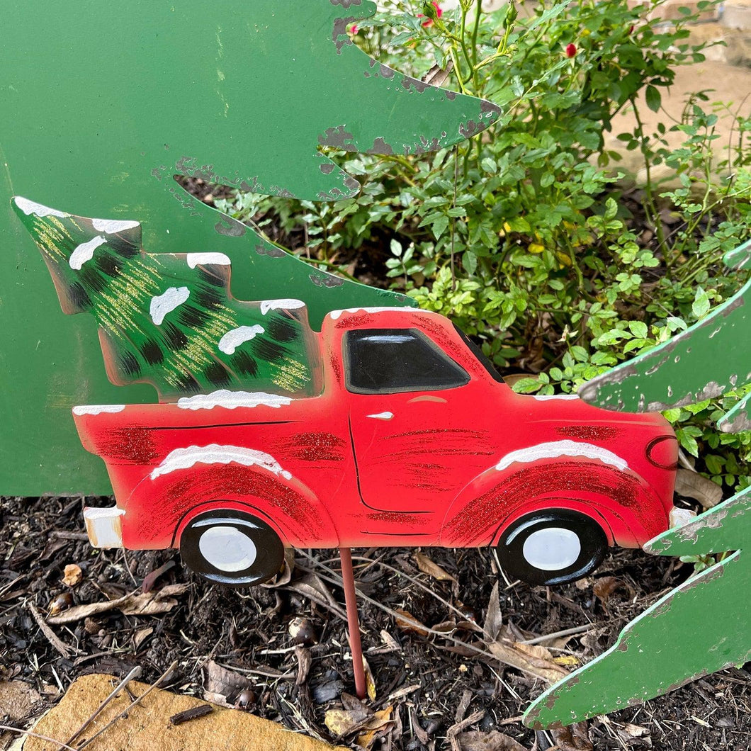 Red Metal Truck Yard Stake with Christmas tree.