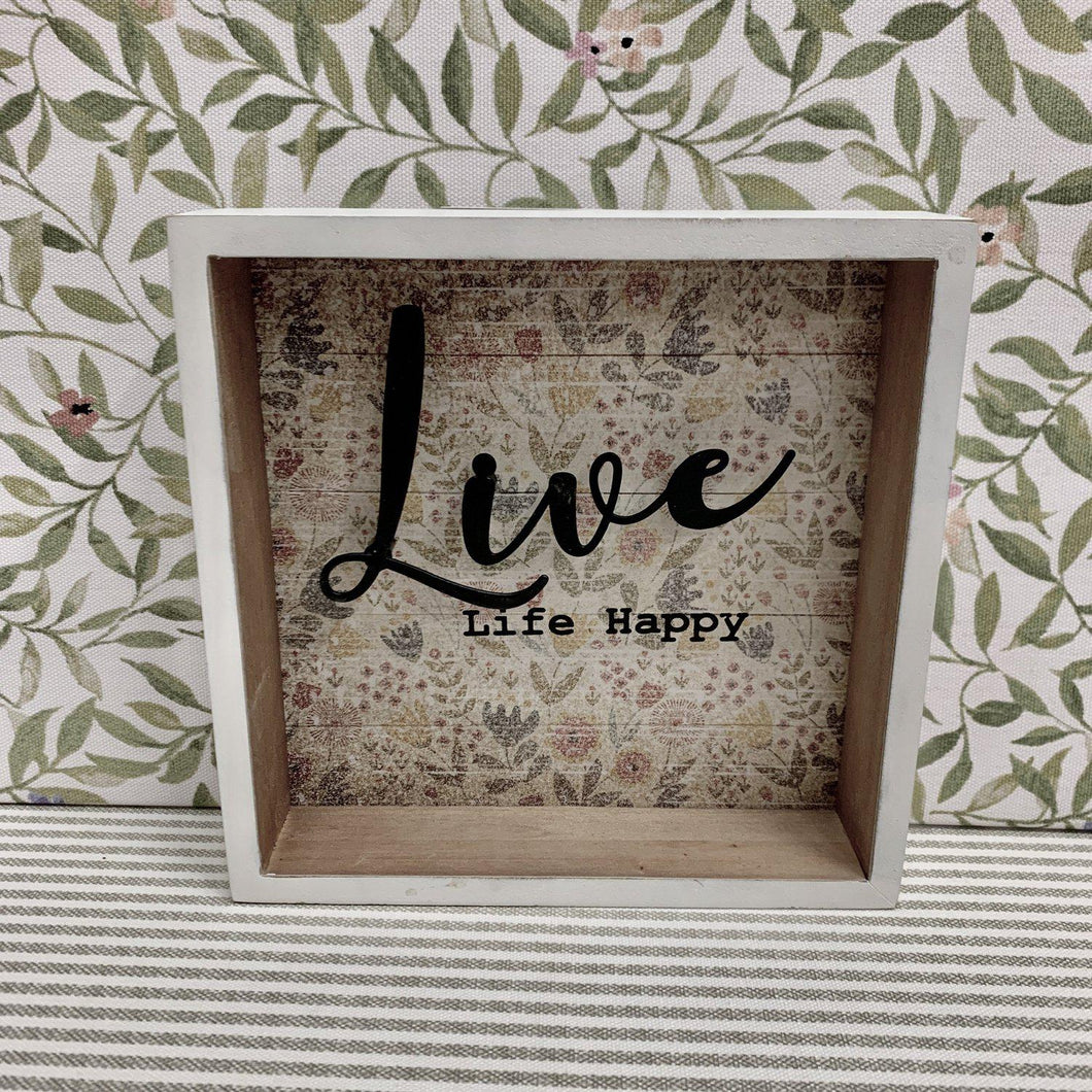 Shadow box art with floral background and raised lettering