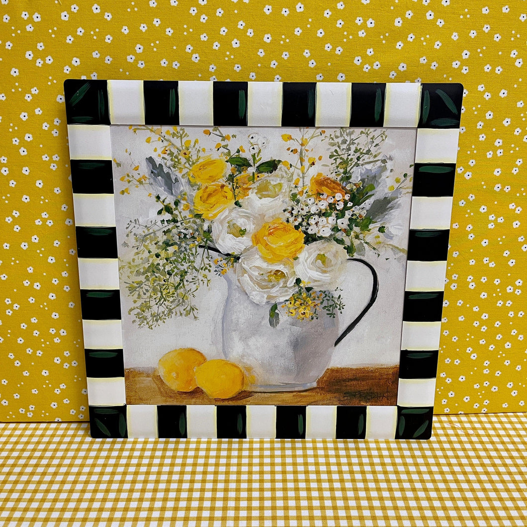 Spring print framed in metal with lemons and florals.
