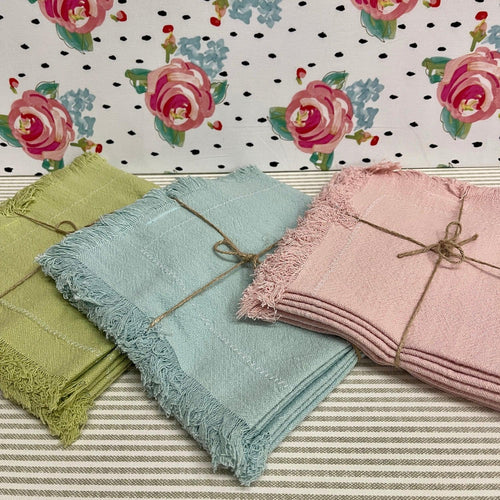  Cloth Dinner Napkins in sets of four in pastel colors.