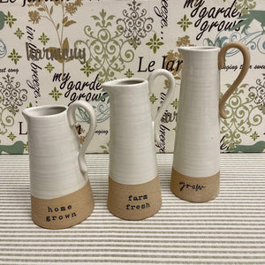 Stoneware Bud Vases with garden theme graphics.