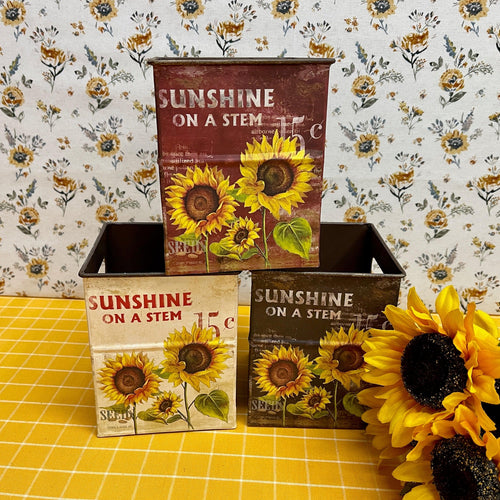 Colorful metal Sunflower Boxes with Spring graphics.