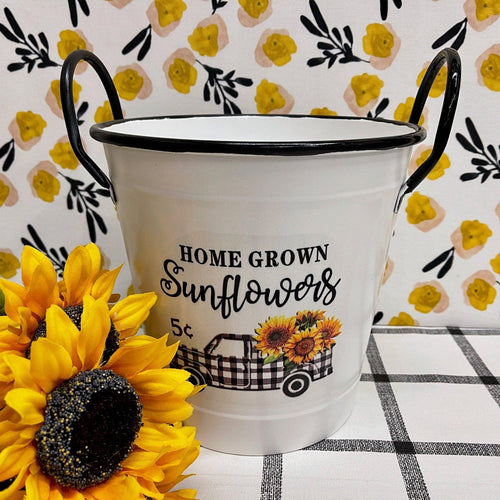 Sunflower Enamel Bucket with black and white checked truck filled with sunflowers.