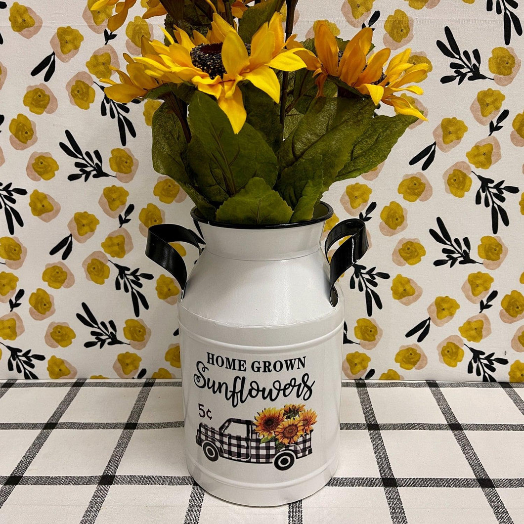 Enamel Milk Can with black and white checked truck filled with sunflowers.