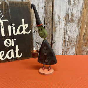 Wooden witch ready for trick or treating