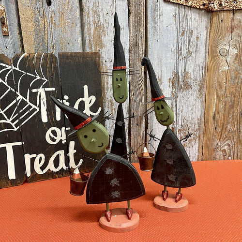 Wooden witches ready for trick or treating