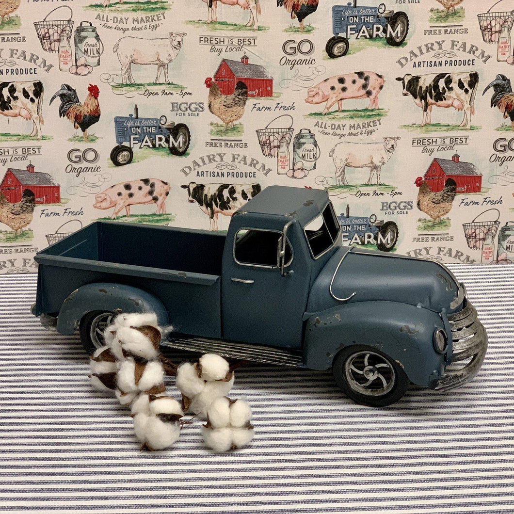 Decorative blue metal farm truck with realistic details 