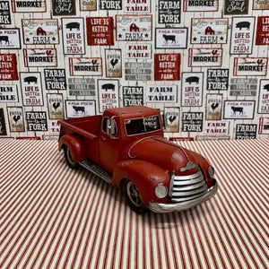 Decorative red metal farm truck