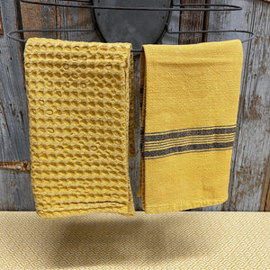 Vintage Style Washed Cotton Dishtowels in a mustard yellow color with a waffle or striped design.