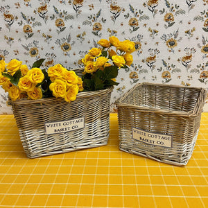 Two-toned White Cottage wicker baskets.