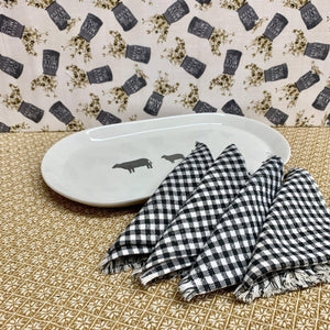 Black and white checked cotton napkins with fringe trim