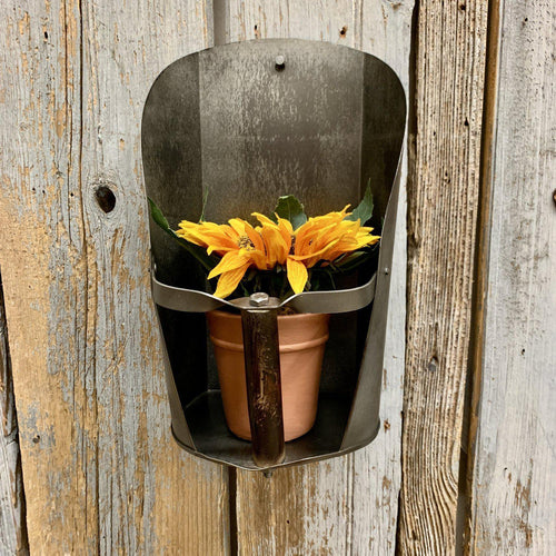 Barn scoop sconce with small plant