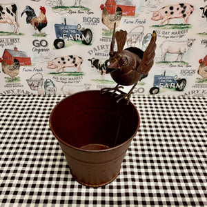 Small rustic metal bucket with bird accent