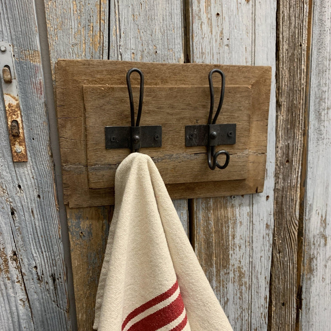 Rustic wood wall hanger with iron hooks and dish towel